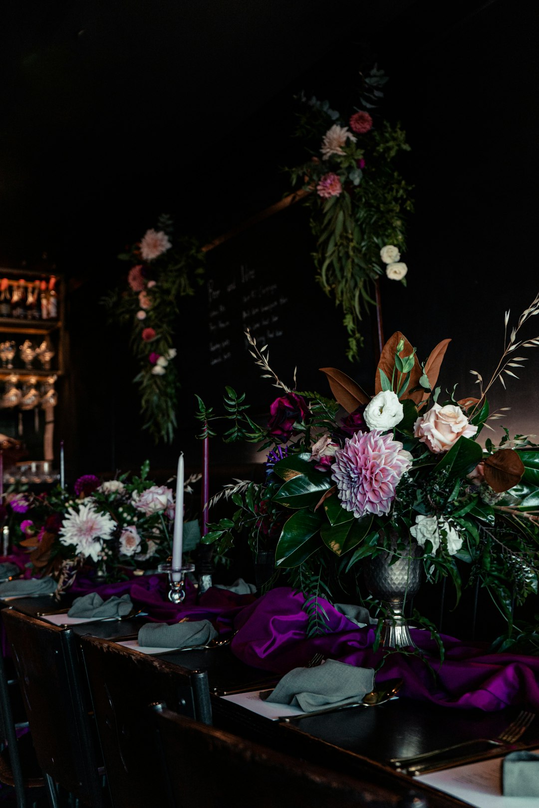featured-portfolio-04 a-long-table-with-purple-and-white-flowers-on-it-lmx02vepr4